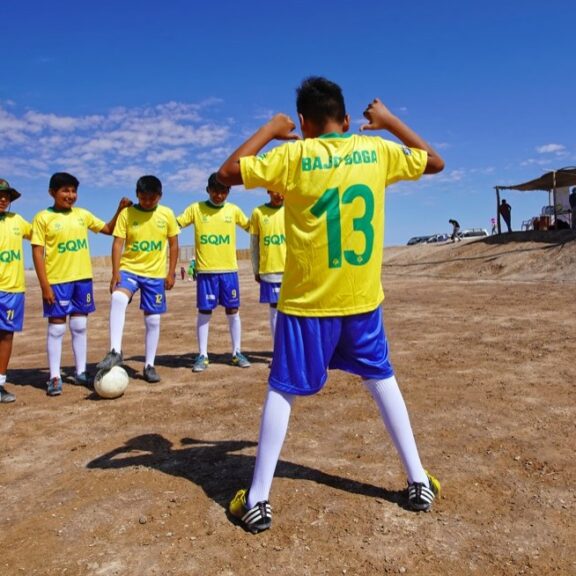 Children in Bajo Soga receive new sports apparel